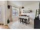 Chic bar space featuring a rustic counter, shelving, pendant lighting, and eye-catching decor at 8367 Devinney St, Arvada, CO 80005