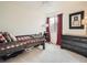 This bedroom features a charming wooden bedframe, desk area, and dark dresser, offering comfort and functionality at 8367 Devinney St, Arvada, CO 80005