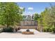 Picturesque community park featuring mature trees, decorative pillars, and a mural under a bright blue sky at 8367 Devinney St, Arvada, CO 80005