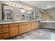 The bathroom features granite counters, wood cabinets, and an enclosed tub at 23076 Oehlmann Park Rd, Conifer, CO 80433