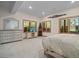 Bedroom with large windows, dresser, and neutral tones providing a calming atmosphere at 23076 Oehlmann Park Rd, Conifer, CO 80433