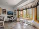 Cozy breakfast nook with nature-themed decor, a large window, and a dining table with two chairs at 23076 Oehlmann Park Rd, Conifer, CO 80433