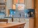 Charming coffee bar area with custom wooden cabinets, granite countertop, and rustic decor at 23076 Oehlmann Park Rd, Conifer, CO 80433