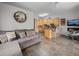 Open-concept space that includes the kitchen, sofa and fireplace at 23076 Oehlmann Park Rd, Conifer, CO 80433