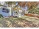 View of the backyard showcasing the well-maintained lawn and a covered porch with seating at 17798 E Ida Ave, Centennial, CO 80015