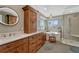 Bright bathroom with freestanding tub, and a separate glass-enclosed shower at 17798 E Ida Ave, Centennial, CO 80015