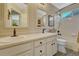 Bright bathroom with double vanity, updated fixtures, and a tiled shower-tub combo at 17798 E Ida Ave, Centennial, CO 80015