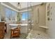 Bathroom showcasing a free-standing tub, a separate glass-enclosed shower, and tile flooring at 17798 E Ida Ave, Centennial, CO 80015