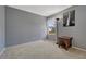 Serene bedroom with soft gray walls, cozy carpet, and natural light from the window at 17798 E Ida Ave, Centennial, CO 80015