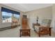 Bright bedroom featuring large window, dresser, and wooden accents at 17798 E Ida Ave, Centennial, CO 80015