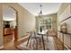 Dining room with a modern light fixture and large window at 17798 E Ida Ave, Centennial, CO 80015