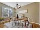 Elegant dining room featuring a modern light fixture and natural light at 17798 E Ida Ave, Centennial, CO 80015