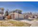 View of home with two-car garage and nice yard at 17798 E Ida Ave, Centennial, CO 80015