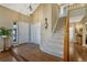 Grand foyer with hardwood floors and a staircase leading to the upper level at 17798 E Ida Ave, Centennial, CO 80015