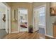 Hallway view to the bedroom and bathroom shows the open floor plan and easy access to different areas of the home at 17798 E Ida Ave, Centennial, CO 80015