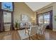 Bright living room featuring a vaulted ceiling and multiple windows at 17798 E Ida Ave, Centennial, CO 80015