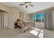 Sunlit main bedroom with a vaulted ceiling, picture window, and comfortable furnishings at 17798 E Ida Ave, Centennial, CO 80015