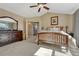 Spacious main bedroom featuring a vaulted ceiling, ensuite bath, and neutral carpeting at 17798 E Ida Ave, Centennial, CO 80015