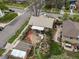 Aerial view showcasing the home's backyard with a stone patio, seating, and water feature at 3242 Utica St, Denver, CO 80212