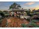 Inviting backyard featuring a flagstone patio with a fire pit, comfortable seating, and ambient lighting at 3242 Utica St, Denver, CO 80212