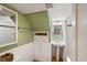 Bathroom featuring built-in storage and combined shower and bathtub at 3242 Utica St, Denver, CO 80212