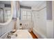 Charming bathroom featuring vintage-style fixtures and bright white tile at 3242 Utica St, Denver, CO 80212