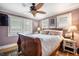 Comfortable bedroom with a ceiling fan, ample natural light, and a cozy atmosphere at 3242 Utica St, Denver, CO 80212