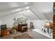 Cozy finished attic space with white wood paneling and traditional wooden desk at 3242 Utica St, Denver, CO 80212