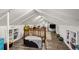 Finished attic space with built-in shelving and wood floors providing ample storage at 3242 Utica St, Denver, CO 80212