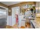 Charming breakfast nook with built-in bench seating, dining table, and natural light from the window at 3242 Utica St, Denver, CO 80212