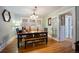 Elegant dining room with hardwood floors, classic lighting, and ample seating at 3242 Utica St, Denver, CO 80212