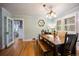 Bright dining room featuring hardwood floors, traditional lighting, and a unique bench at 3242 Utica St, Denver, CO 80212