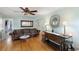 Bright living room featuring hardwood floors, vintage sofa, and decorative furnishings at 3242 Utica St, Denver, CO 80212