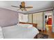 Comfortable bedroom with hardwood floors, neutral walls, a ceiling fan and a wardrobe at 3242 Utica St, Denver, CO 80212