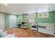 Home office featuring tiled floors, built-in shelving, multiple closets, and bright window light at 3242 Utica St, Denver, CO 80212
