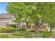 Inviting exterior showcases lush landscaping, brick details, and a well-maintained facade at 2980 W Long Dr # E, Littleton, CO 80120