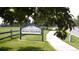 Writers Vista Park sign along a walking path and fenced edge of the park at 2980 W Long Dr # E, Littleton, CO 80120