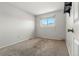 Bright bedroom with neutral walls and carpet at 1170 S Troy St, Aurora, CO 80012