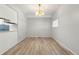 Simple dining area with light walls and wood-look flooring at 1170 S Troy St, Aurora, CO 80012