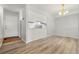 Bright dining area with light wood flooring and an open concept design at 1170 S Troy St, Aurora, CO 80012