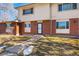 Neat brick front of a townhome, showcasing its landscaping and walkway at 1170 S Troy St, Aurora, CO 80012