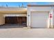 Garage with carport and no parking sign at 1170 S Troy St, Aurora, CO 80012