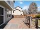 Back deck with steps leading into the back yard of this home at 13755 W Amherst Way, Lakewood, CO 80228