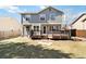 Backyard showing the deck, lawn, and garden beds at 13755 W Amherst Way, Lakewood, CO 80228