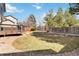 Backyard featuring a deck, lawn, and gardening area with a fence for privacy at 13755 W Amherst Way, Lakewood, CO 80228