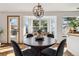 Inviting dining area with bay window offering natural light and neighborhood views at 13755 W Amherst Way, Lakewood, CO 80228