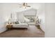 Spacious main bedroom with vaulted ceiling, large windows, and a ceiling fan at 13755 W Amherst Way, Lakewood, CO 80228