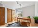 Bright home office featuring natural light, wood desk, decorative rug, and closet with sliding doors at 13755 W Amherst Way, Lakewood, CO 80228