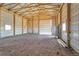 Spacious barn interior with metal walls, wood beams, and concrete flooring at 60600 E 56Th Ave, Strasburg, CO 80136