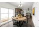 Bright dining area with a wooden table and chairs at 60600 E 56Th Ave, Strasburg, CO 80136